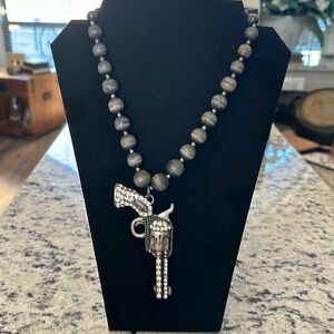16 inches at it’s longest rhinestone gun necklace